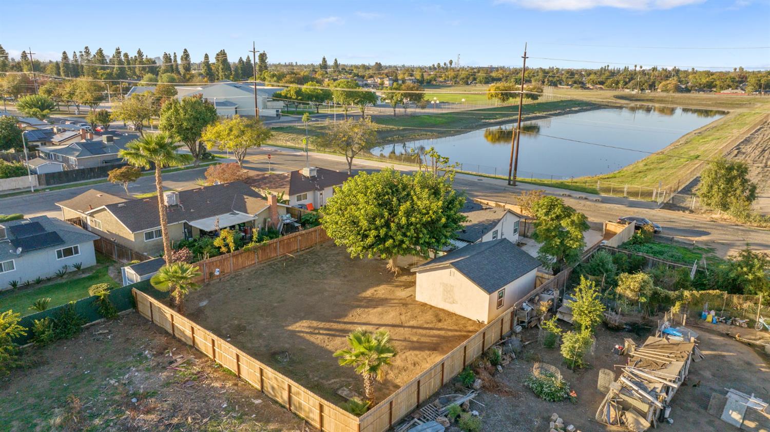 4722 East Florence Avenue Fresno, CA 93725 - Photo 47 of 51 an aerial view of residential houses with outdoor space and lake view