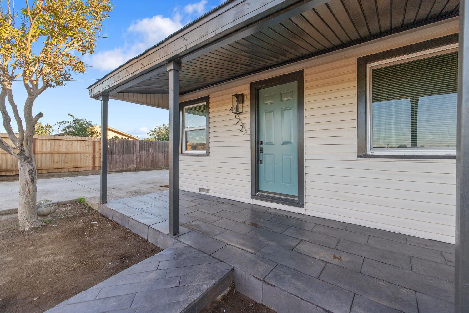4722 East Florence Avenue Fresno, CA 93725 - Photo 5 of 51 a porch with a glass door