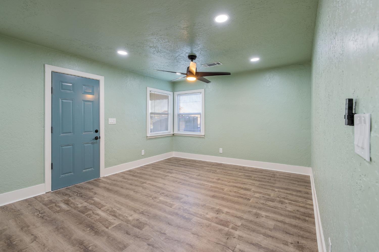4722 East Florence Avenue Fresno, CA 93725 - Photo 6 of 51 a view of an empty room with a window