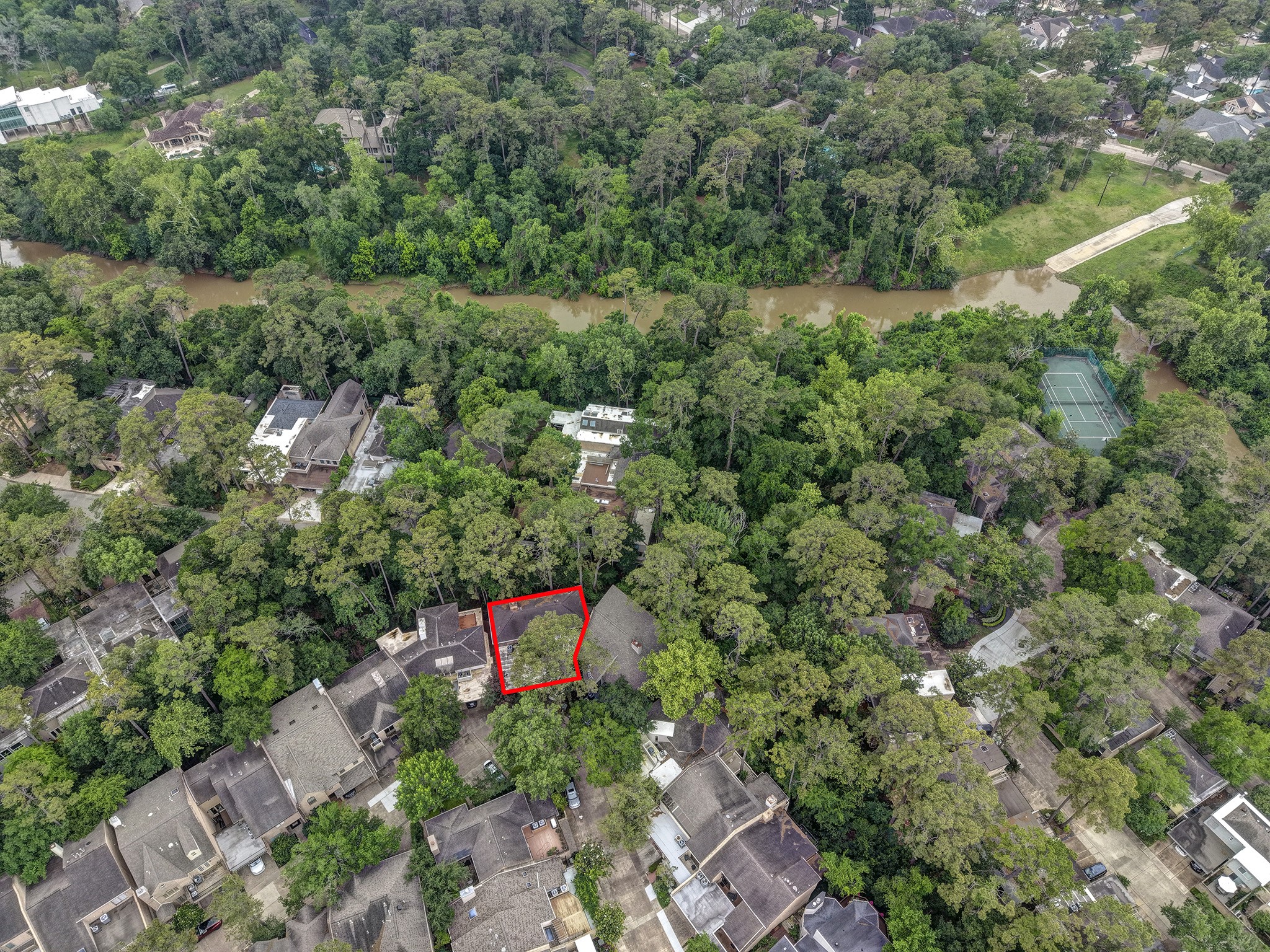 201 Vanderpool Lane, Unit 130 Houston, TX 77024 - Photo 34 of 41 The community tennis courts as well as the community pool (not pictured) sit along Buffalo Bayou.