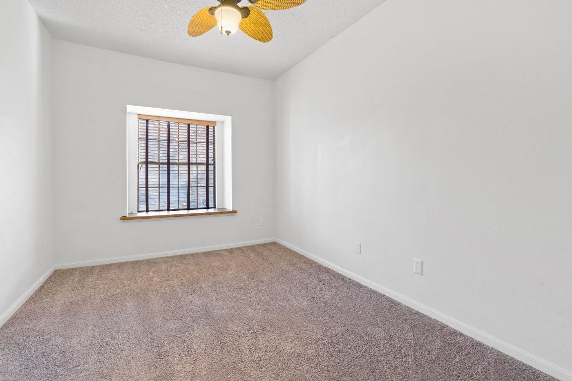 10819 Crown Colony Drive, Unit 22 Austin, TX 78747 - Photo 13 of 16 an empty room with a window