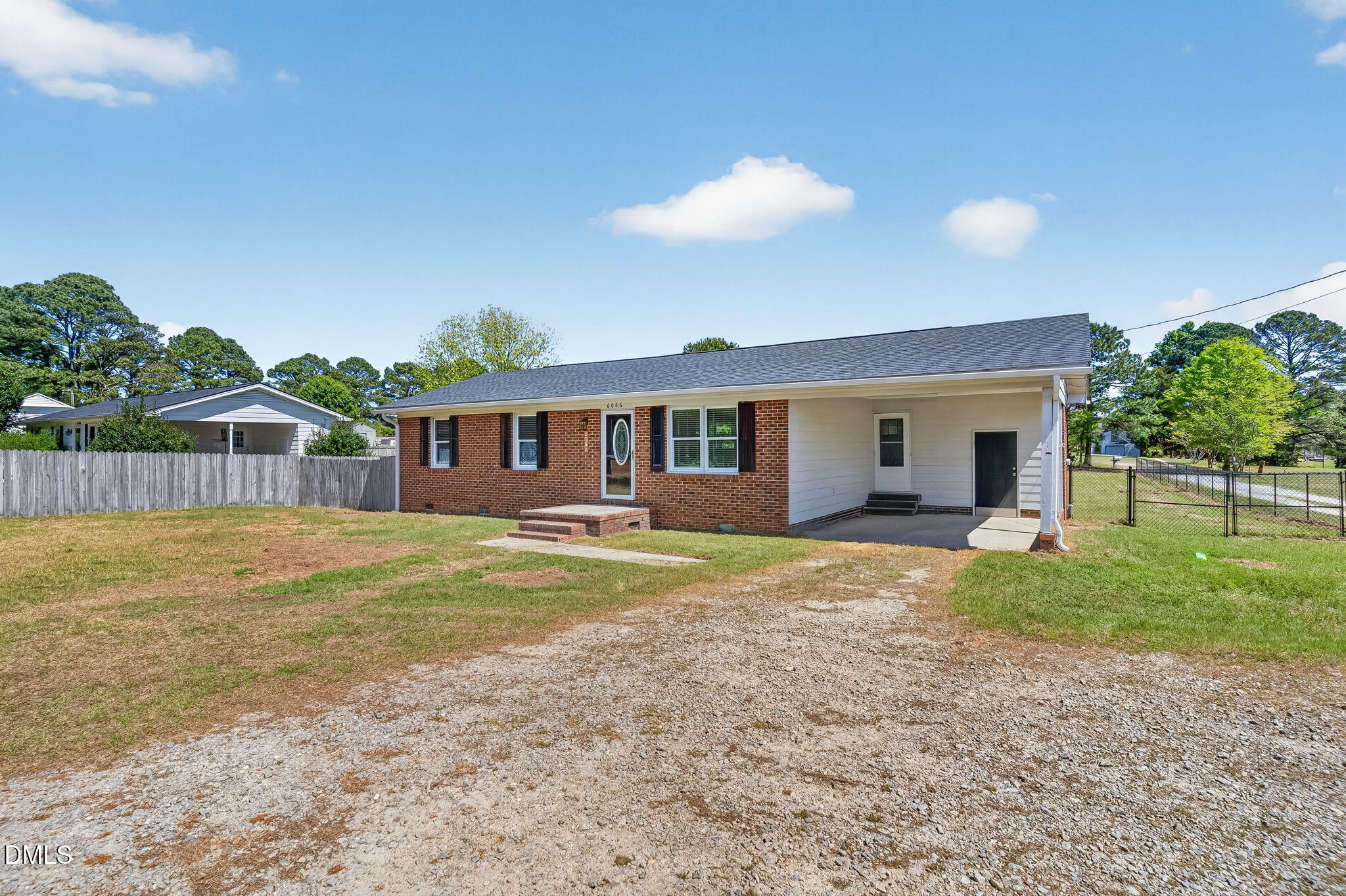 6086 Red Hill Church Road Coats, NC 27521 - Photo 4 of 44 a view of a house with backyard and a tree