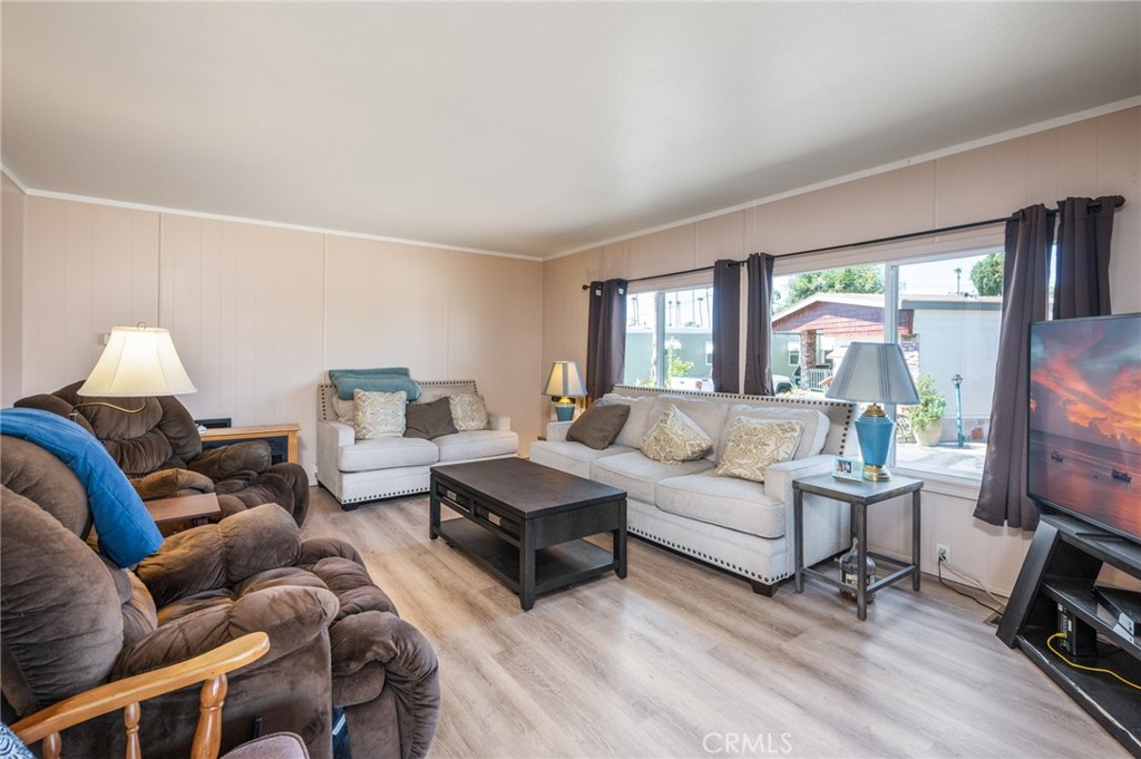 750 East Carson Street, Unit 116 Carson, CA 90745 - Photo 1 of 1 a living room with furniture flat screen tv and a large window