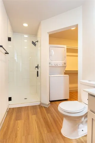 a bathroom with a toilet and a shower