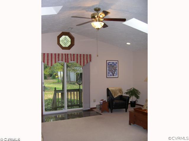 827 Three Chopt Road Manakin-Sabot, VA 23103 - Photo 8 of 12 a living room with furniture and a floor to ceiling window