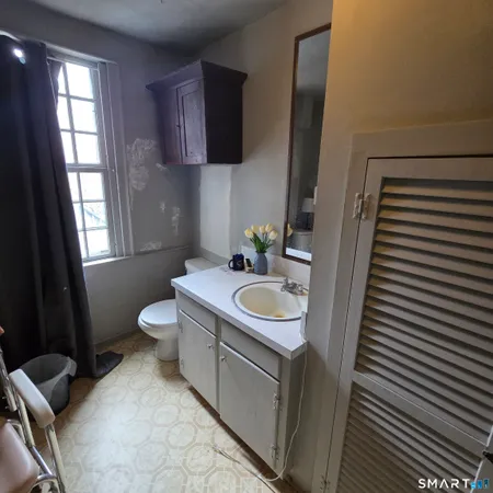 a bathroom with a sink and a toilet