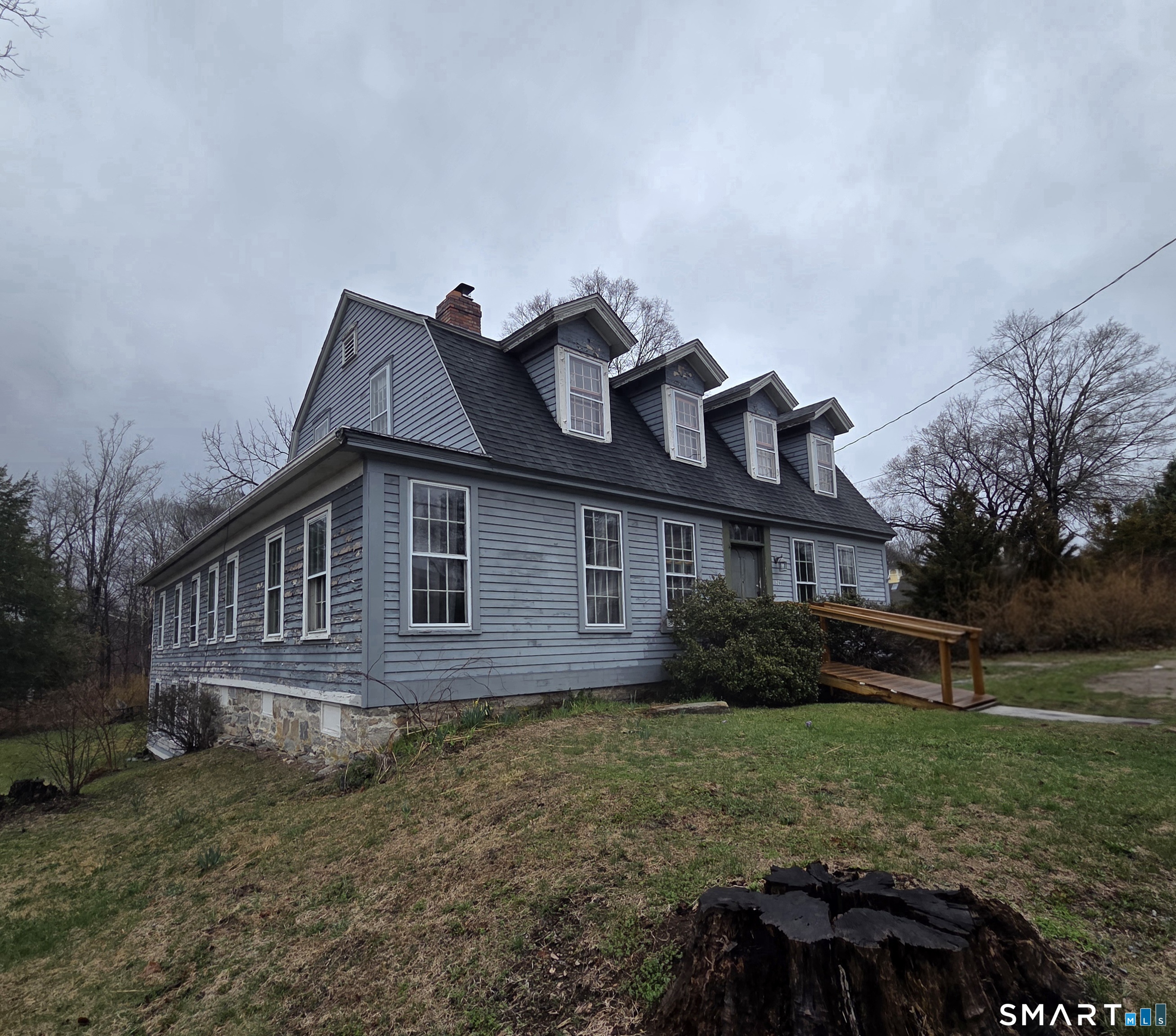 26 Plains Road Windham, CT 06280 - Photo 2 of 32 a front view of a house with garden