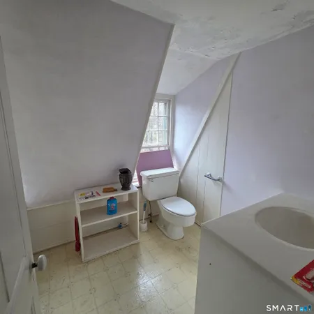 a bathroom with a sink a toilet and a bathtub