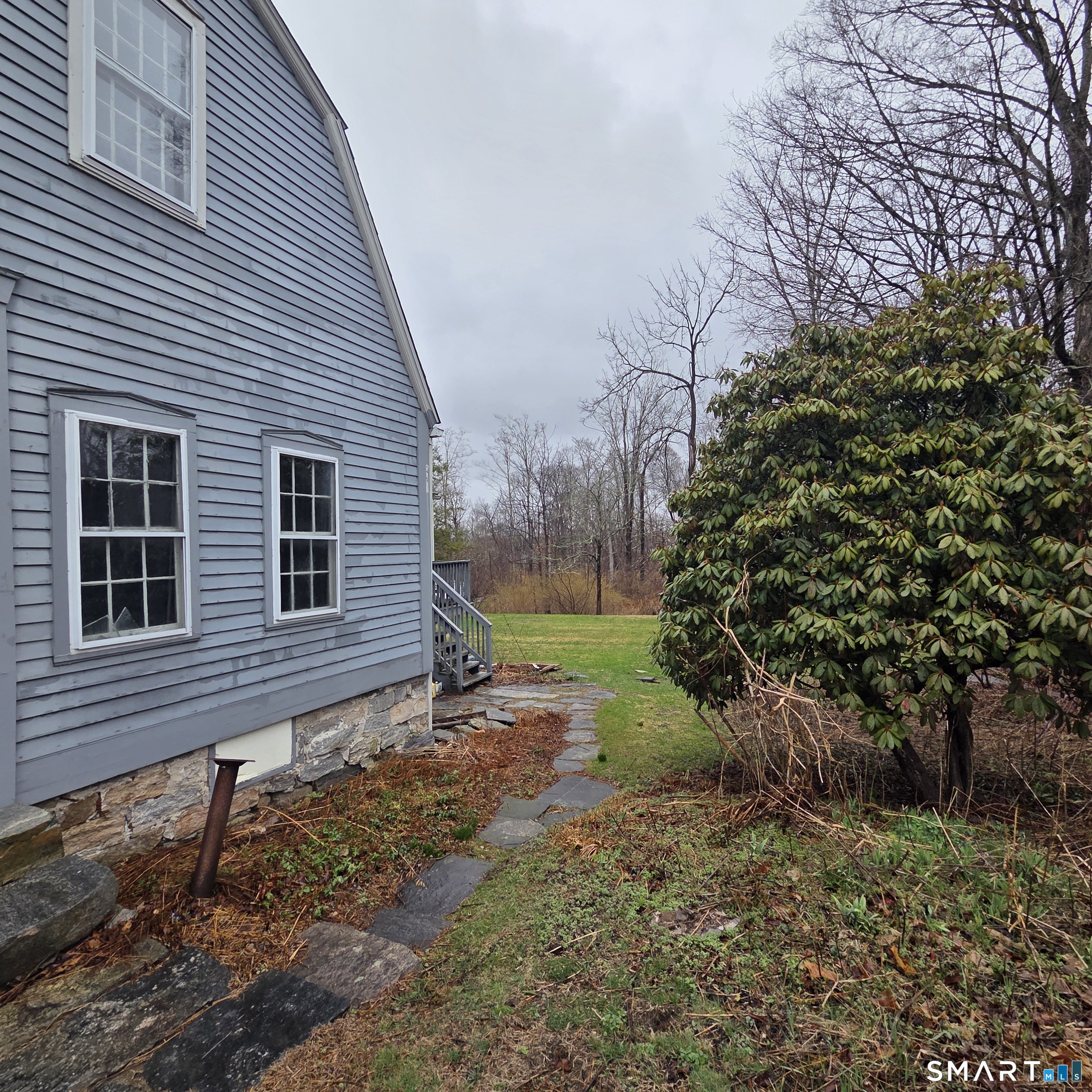 26 Plains Road Windham, CT 06280 - Photo 7 of 32 a view of a house with a yard