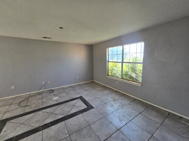 a view of an empty room and window