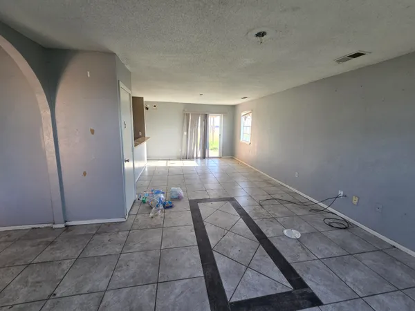 a hallway with a black white checkered floor
