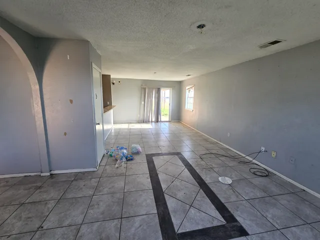 a hallway with a black white checkered floor