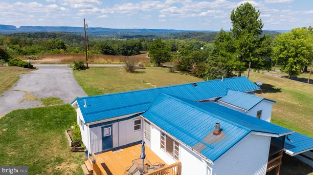 an aerial view of a house with a garden