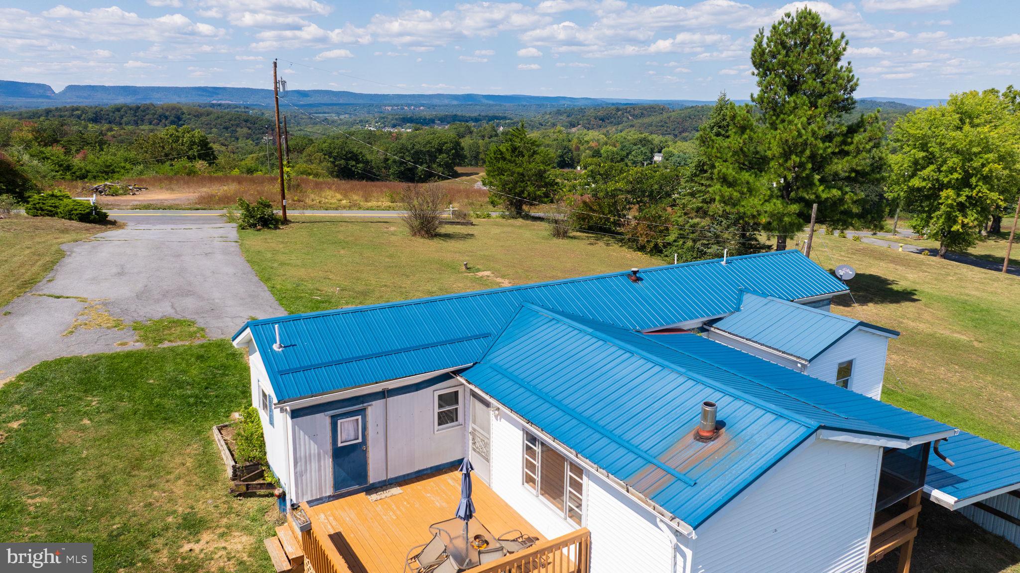an aerial view of a house with a garden