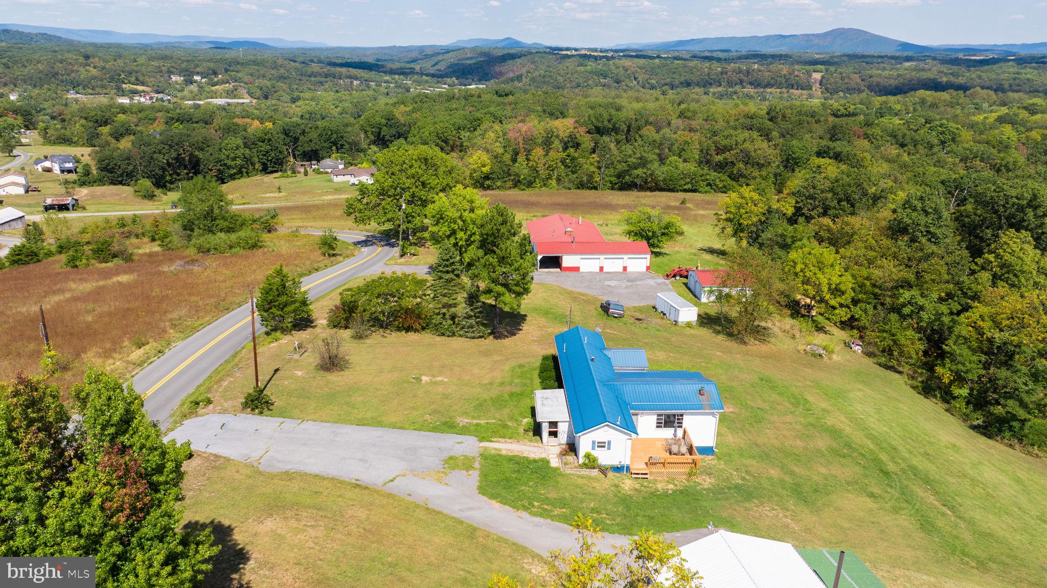 5386 Pious Ridge Road Berkeley Springs, WV 25411 - Photo 18 of 20 an aerial view of residential houses with outdoor space