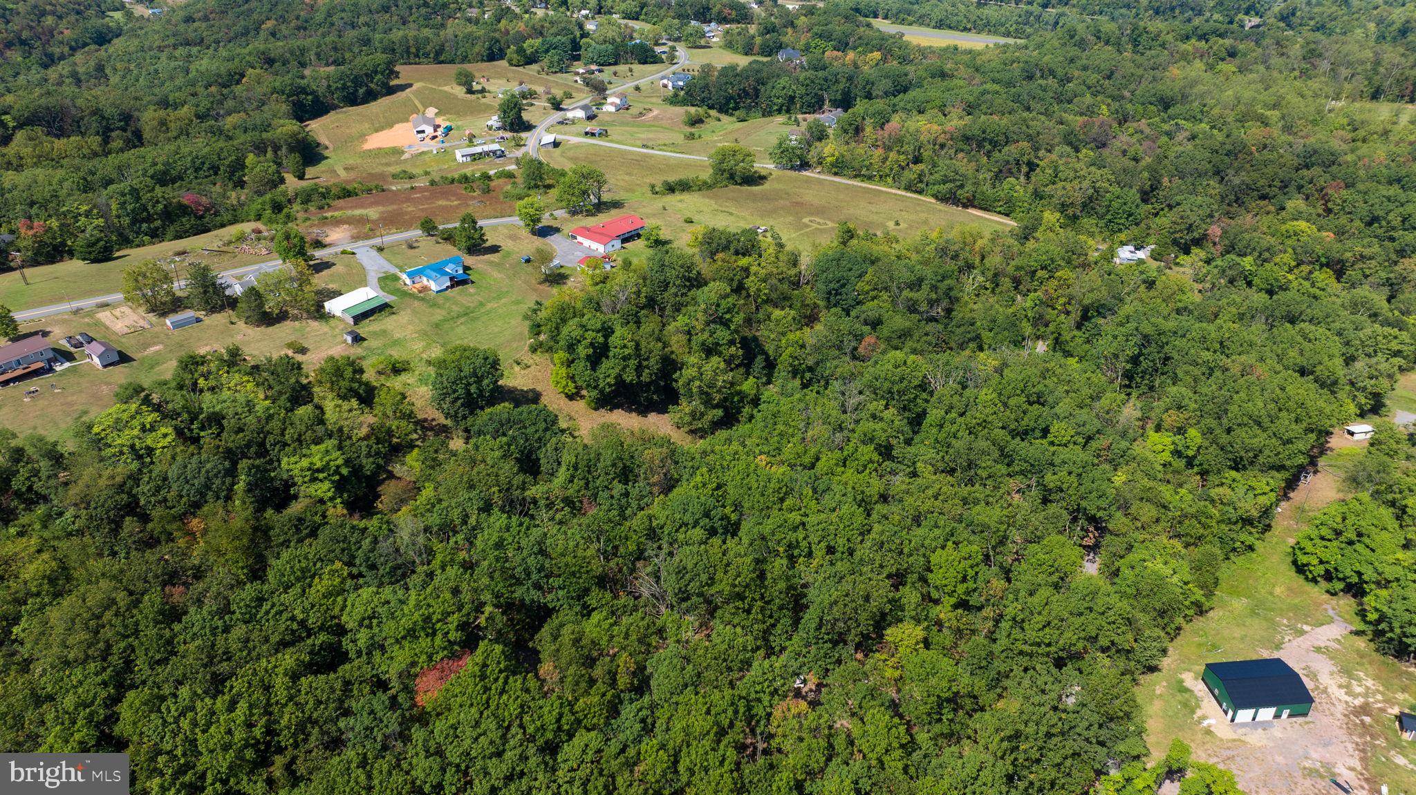 5386 Pious Ridge Road Berkeley Springs, WV 25411 - Photo 5 of 20 an aerial view of a house with a yard