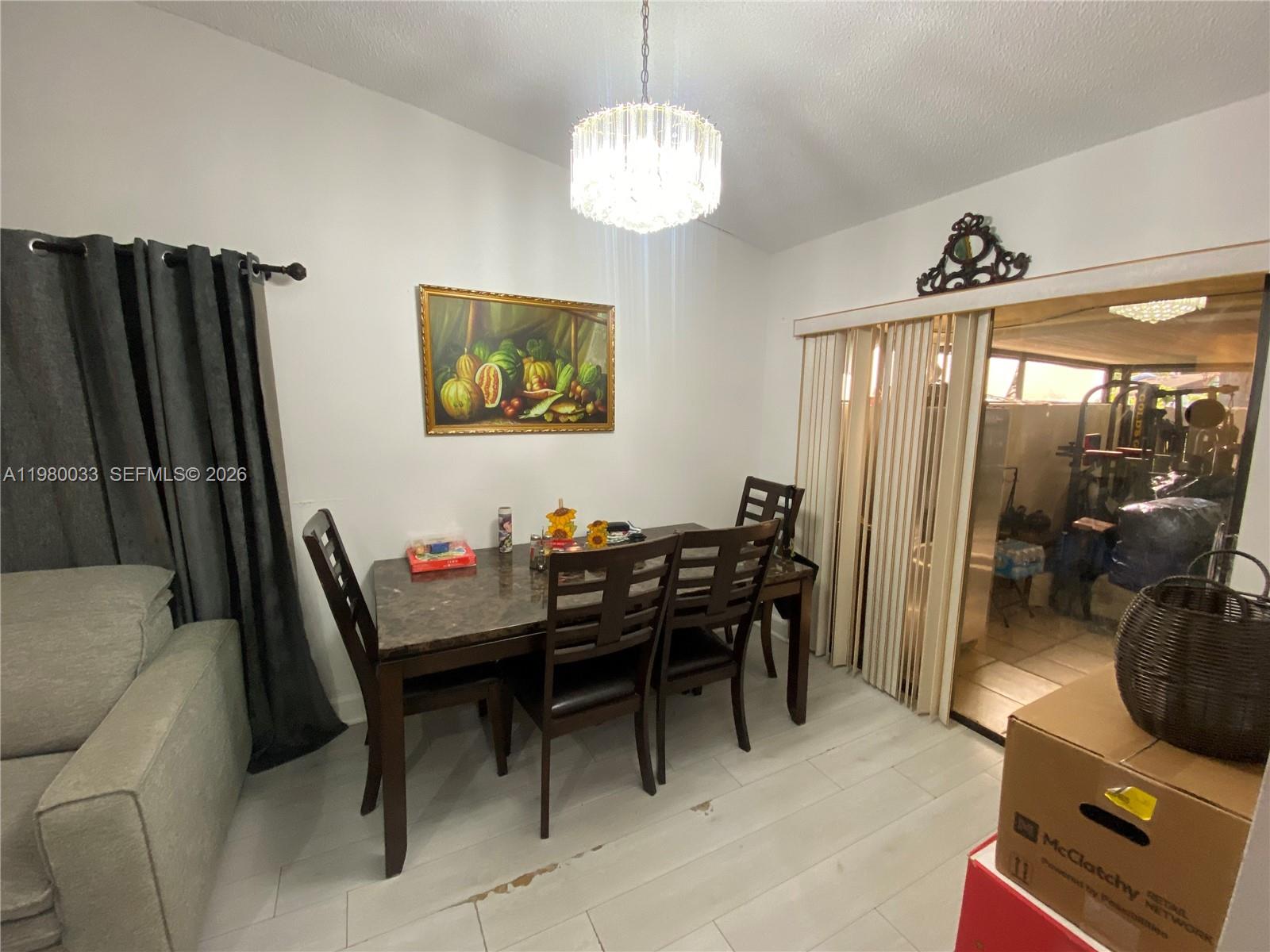 13815 Southwest 54th Street Miami, FL 33175 - Photo 12 of 23 a view of a livingroom with furniture and window