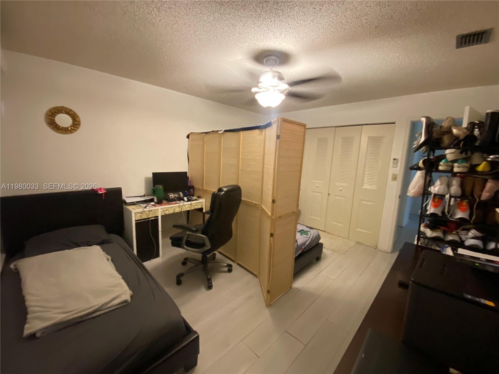 13815 Southwest 54th Street Miami, FL 33175 - Photo 19 of 23 a view of a workspace with furniture and a window