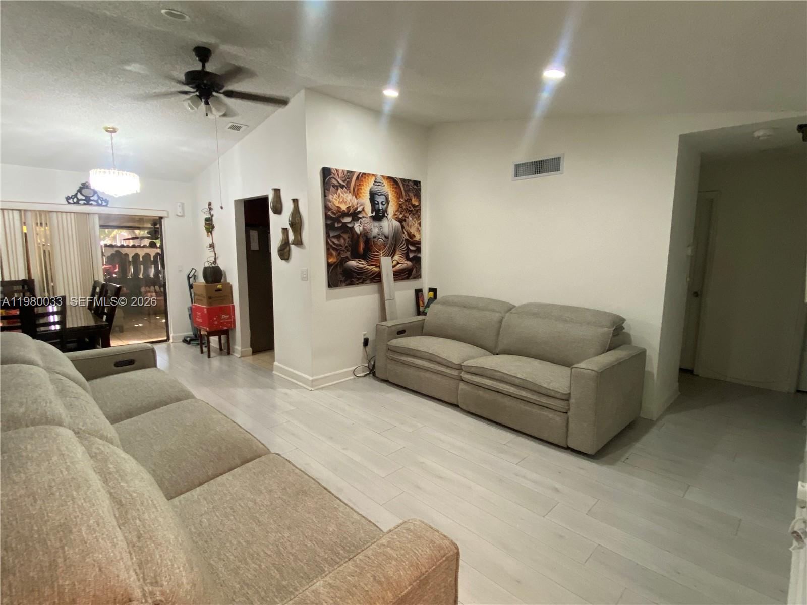13815 Southwest 54th Street Miami, FL 33175 - Photo 3 of 23 a living room with furniture and a ceiling fan