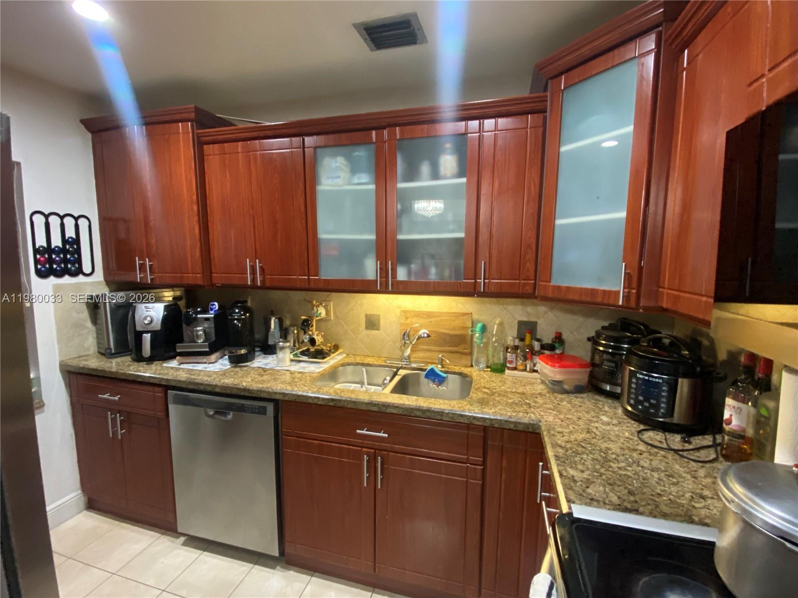 13815 Southwest 54th Street Miami, FL 33175 - Photo 8 of 23 a kitchen with a sink and a cabinets
