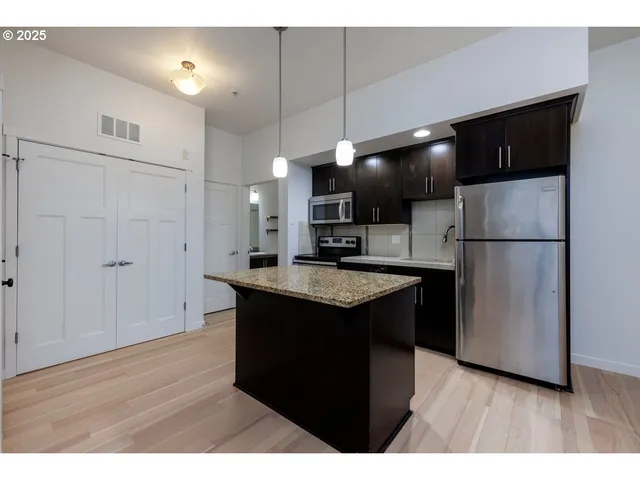a kitchen with a counter space and a sink