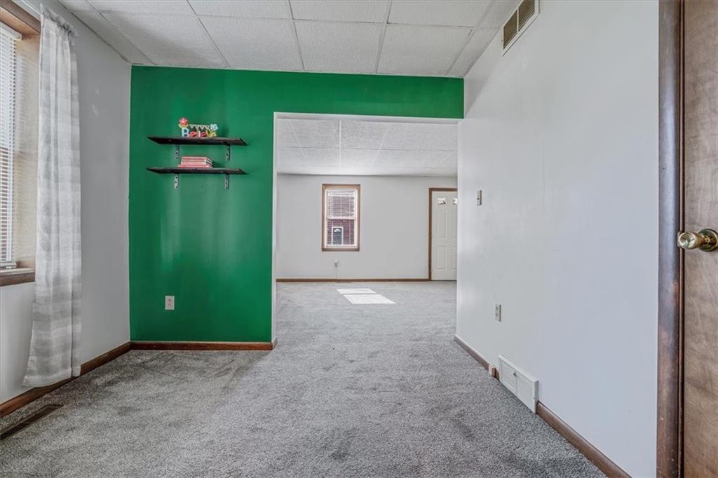 206 Washington Street Beaver, PA 15009 - Photo 12 of 32 a view of a kitchen with a fridge and a sink