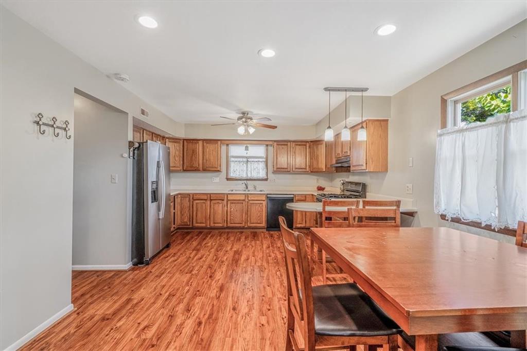 206 Washington Street Beaver, PA 15009 - Photo 13 of 32 a living room with stainless steel appliances furniture a refrigerator and a view of kitchen