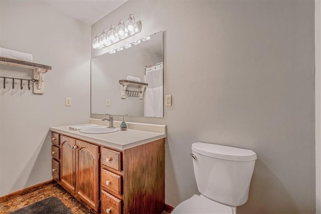 206 Washington Street Beaver, PA 15009 - Photo 18 of 32 a bathroom with a toilet a sink and mirror