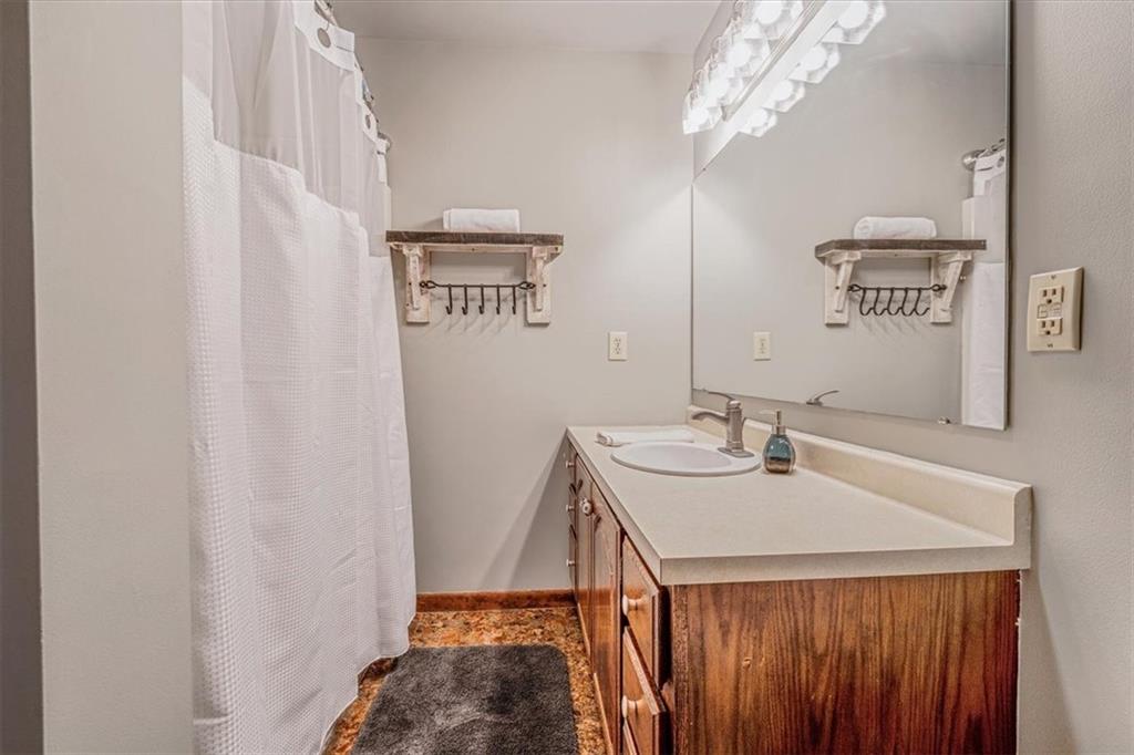 206 Washington Street Beaver, PA 15009 - Photo 19 of 32 a bathroom with a sink a vanity and a mirror