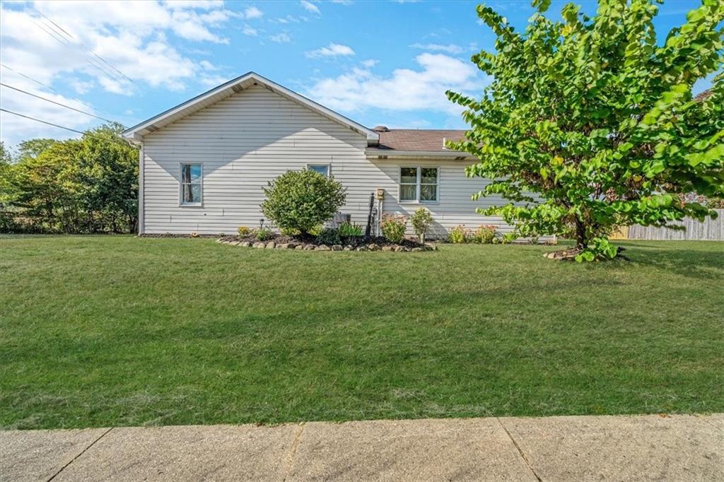 206 Washington Street Beaver, PA 15009 - Photo 3 of 32 a front view of a house with a garden