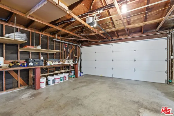 a view of a room with wooden walls