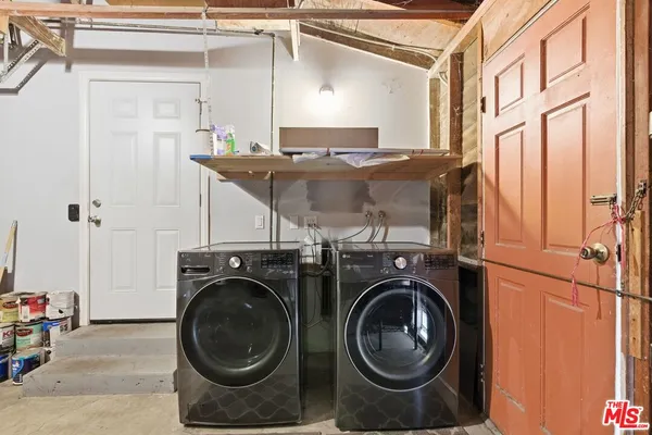 a utility room with dryer and washer