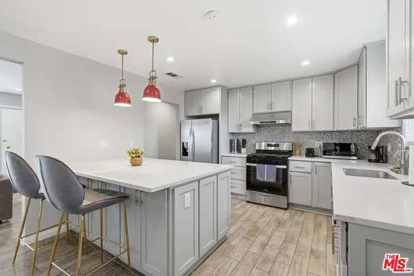 a kitchen that has a cabinets and a stove
