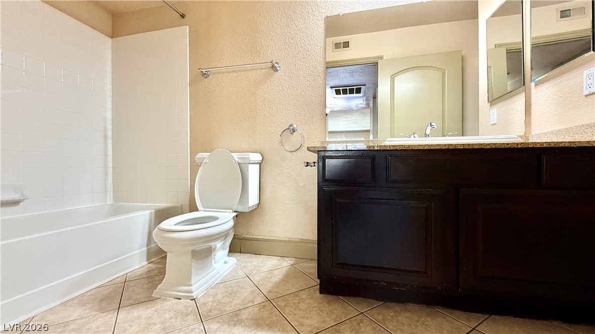 8101 West Flamingo Road, Unit 1082 Las Vegas, NV 89147 - Photo 20 of 23 A well-appointed bathroom with a spacious vanity and combination tub-shower.