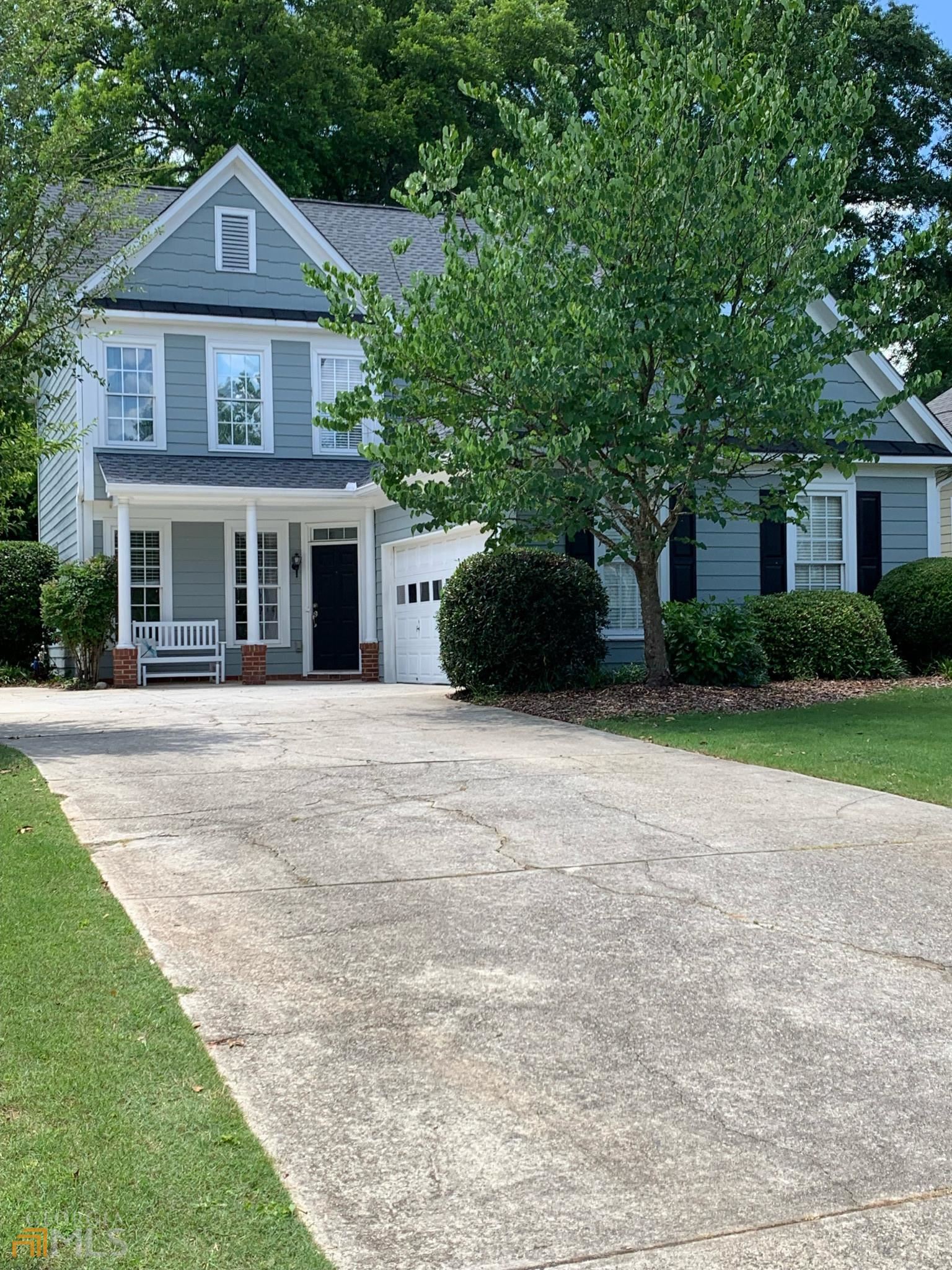 414 Lockwood Terrace Decatur, GA 30030 - Photo 1 of 1 a front view of a house with a yard and garage