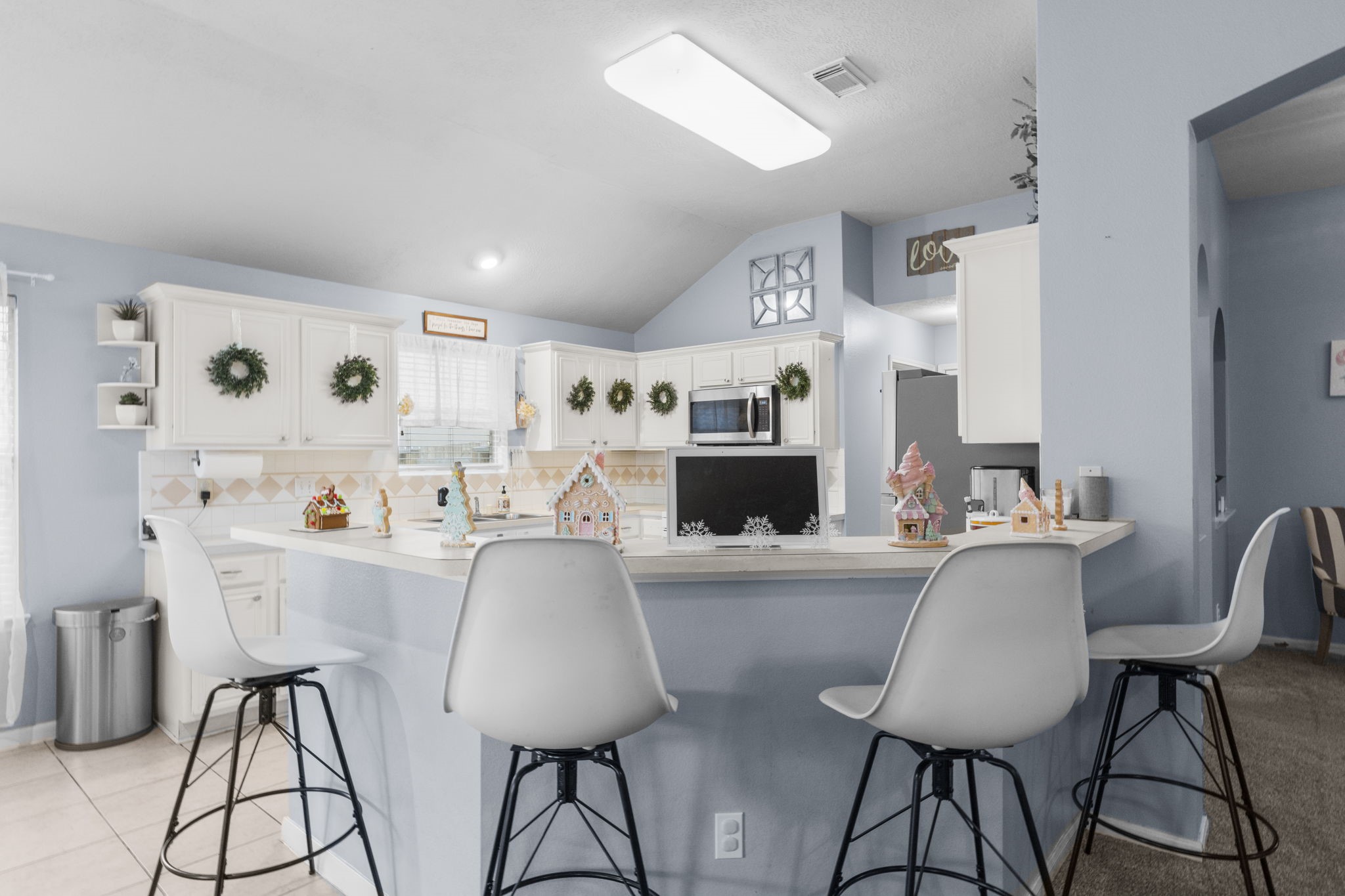 17238 Stonebridge Trail Houston, TX 77095 - Photo 14 of 25 a living room with furniture a flat screen tv and a dining table