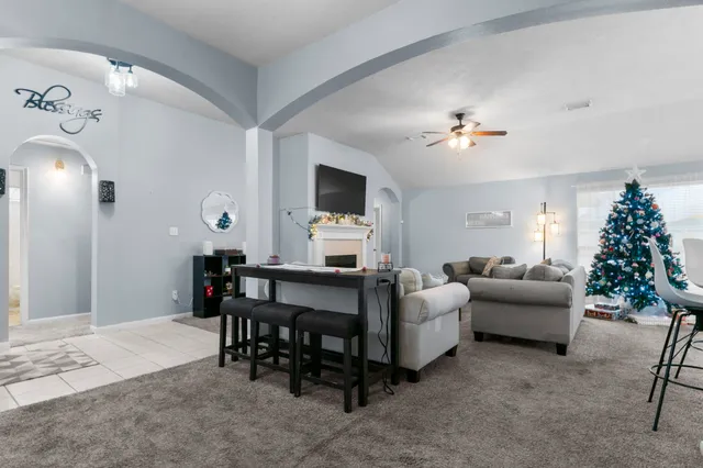 a view of a livingroom with furniture and a chandelier