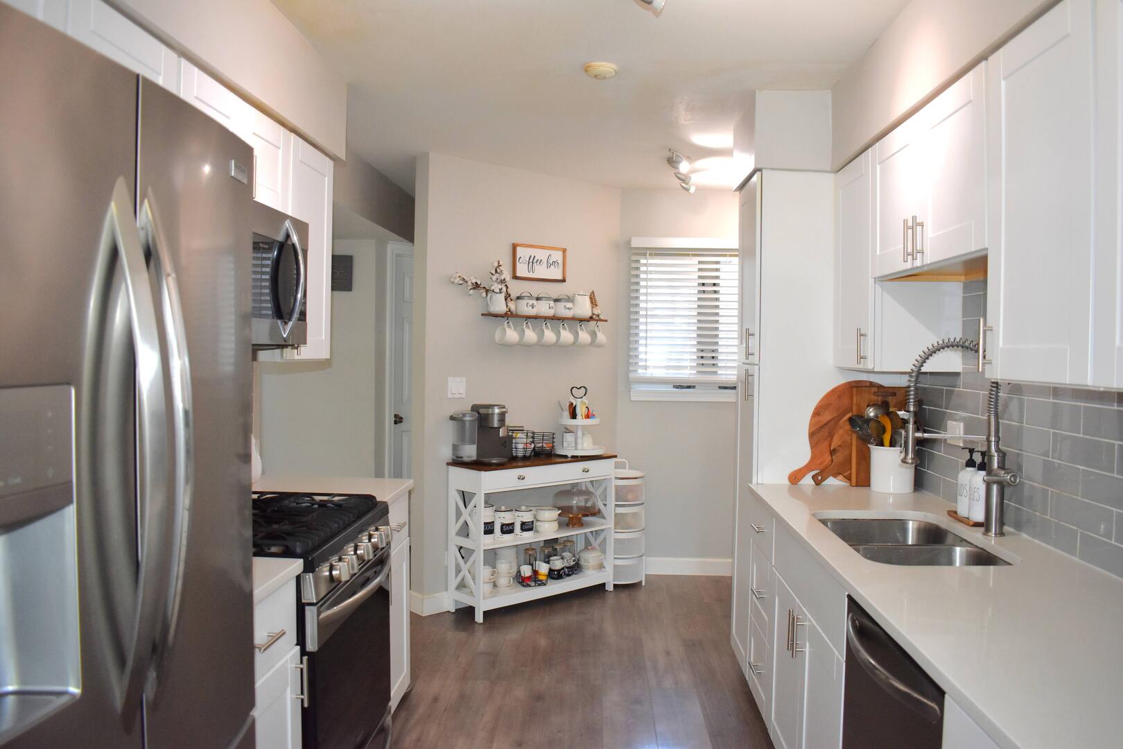 8301 High Point Circle, Unit C Darien, IL 60561 - Photo 11 of 35 a kitchen with stainless steel appliances a sink stove and refrigerator