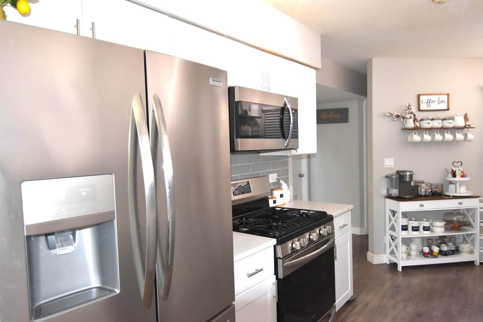 8301 High Point Circle, Unit C Darien, IL 60561 - Photo 15 of 35 a kitchen with stainless steel appliances granite countertop a refrigerator and a stove