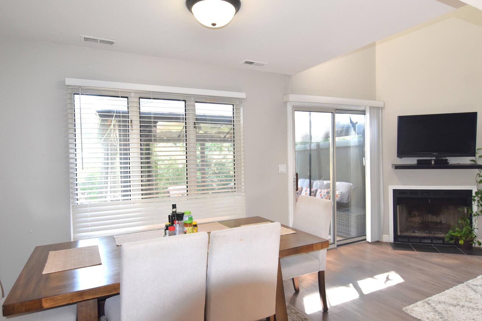 8301 High Point Circle, Unit C Darien, IL 60561 - Photo 18 of 35 a dining room with furniture and a fireplace