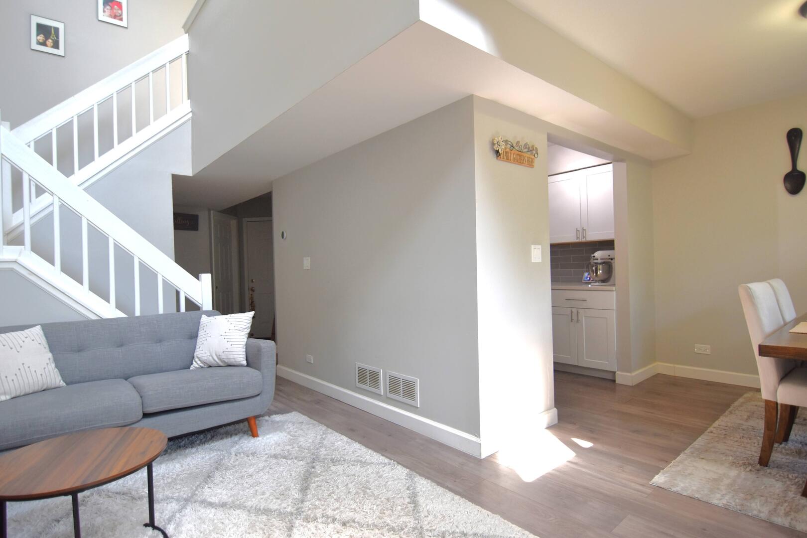 8301 High Point Circle, Unit C Darien, IL 60561 - Photo 19 of 35 a living room with furniture and a rug