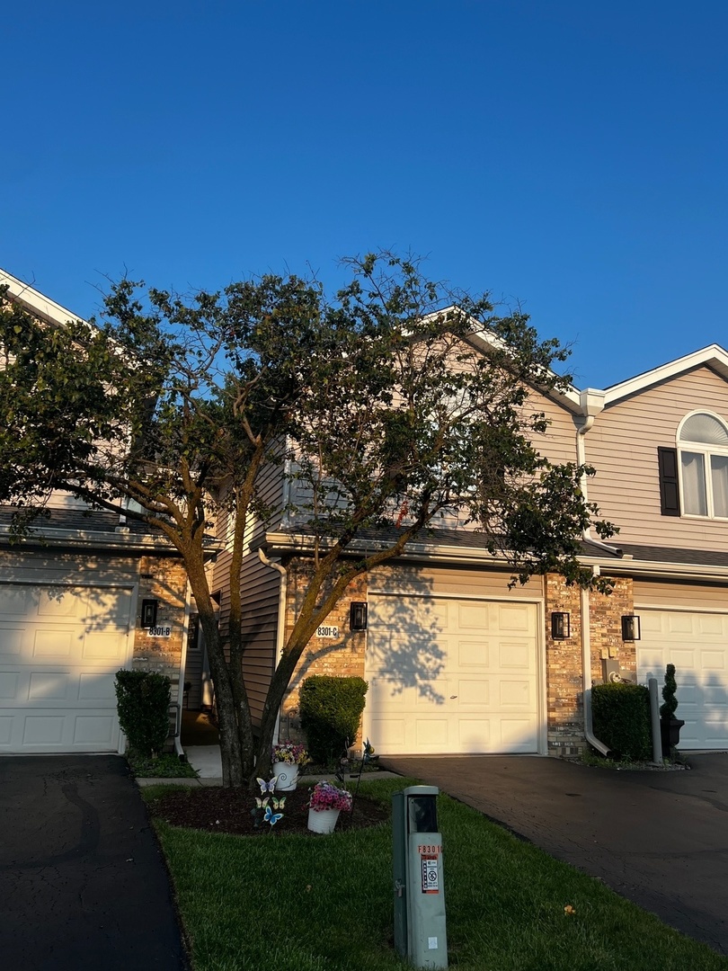 8301 High Point Circle, Unit C Darien, IL 60561 - Photo 2 of 35 a view of a lake with a outdoor space