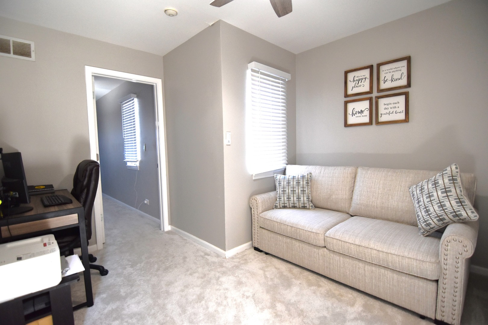 8301 High Point Circle, Unit C Darien, IL 60561 - Photo 23 of 35 a living room with furniture and a window