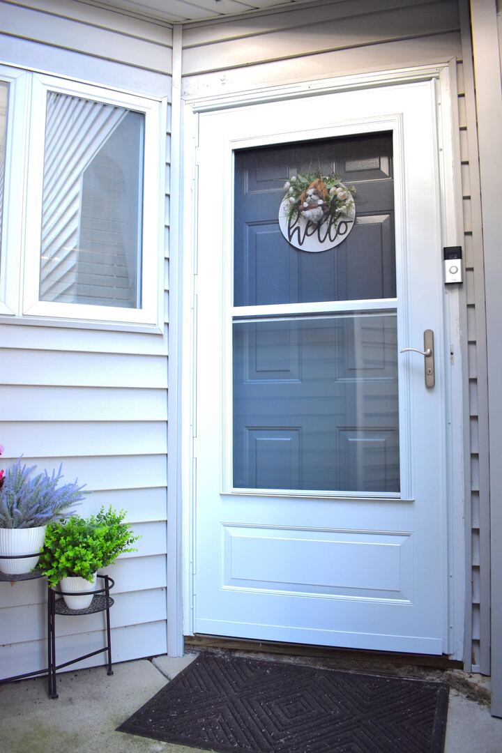 8301 High Point Circle, Unit C Darien, IL 60561 - Photo 5 of 35 a view of entrance door of the house