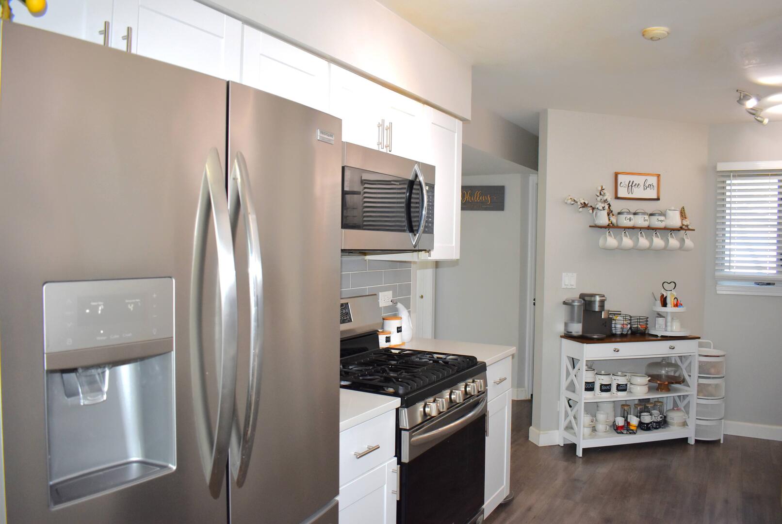 8301 High Point Circle, Unit C Darien, IL 60561 - Photo 9 of 35 a kitchen with stainless steel appliances a refrigerator a stove and a sink