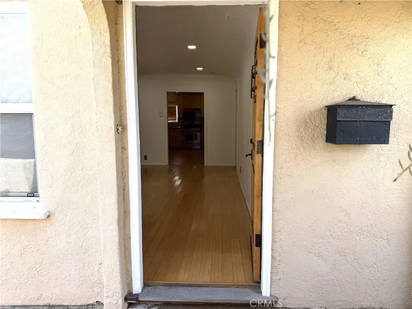 a view of empty room with window and fireplace