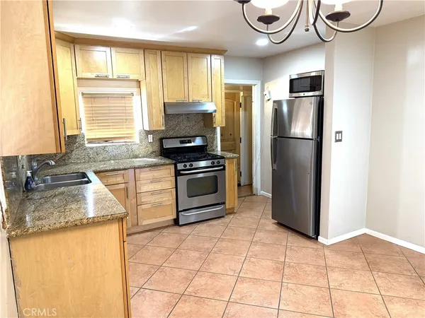 a view of a kitchen with a sink