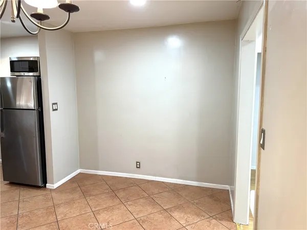 a view of a bathroom with a shower and a sink
