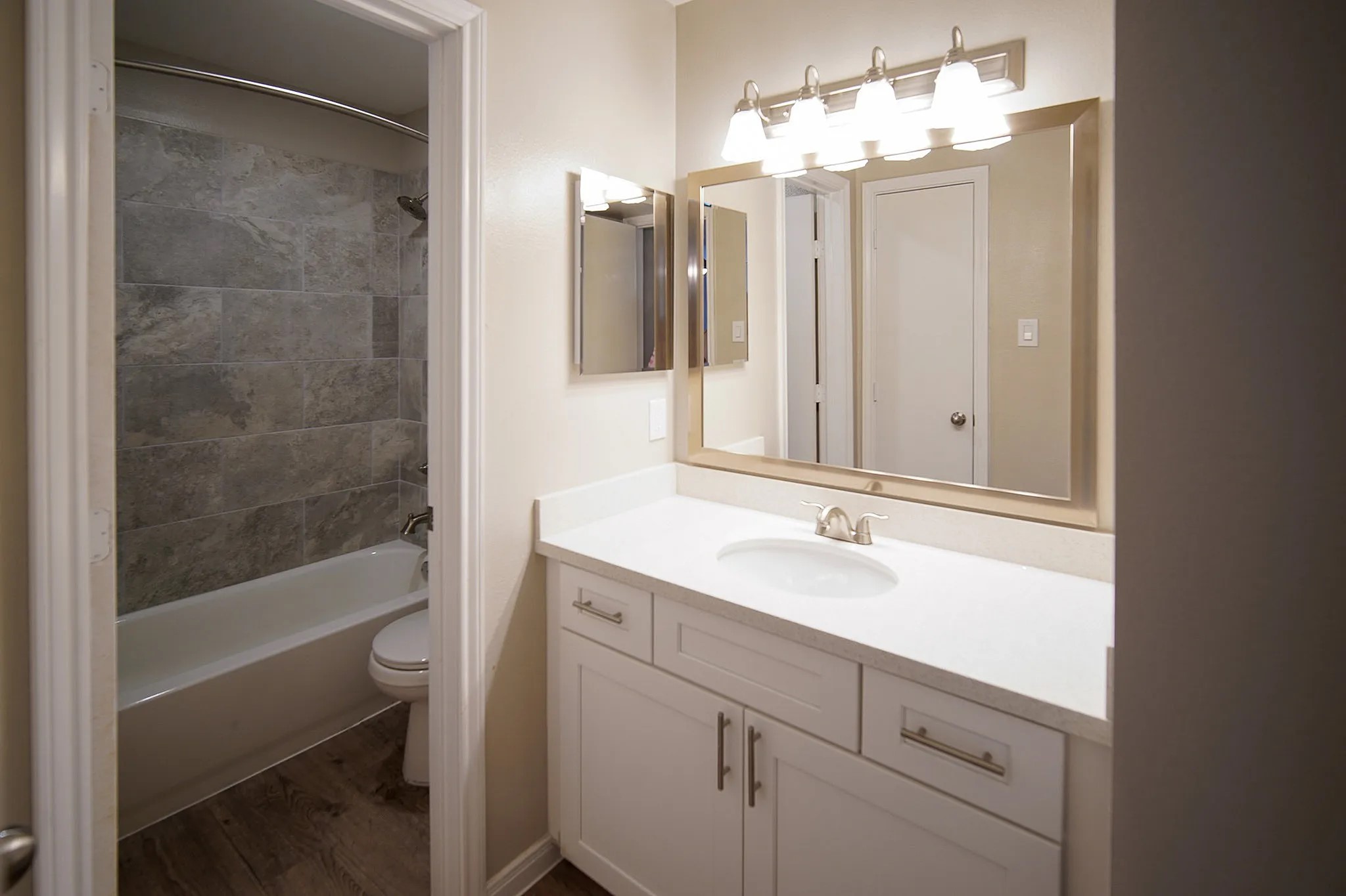 8455 Will Clayton Parkway, Unit 103 Humble, TX 77338 - Photo 18 of 23 a bathroom with a sink and a mirror