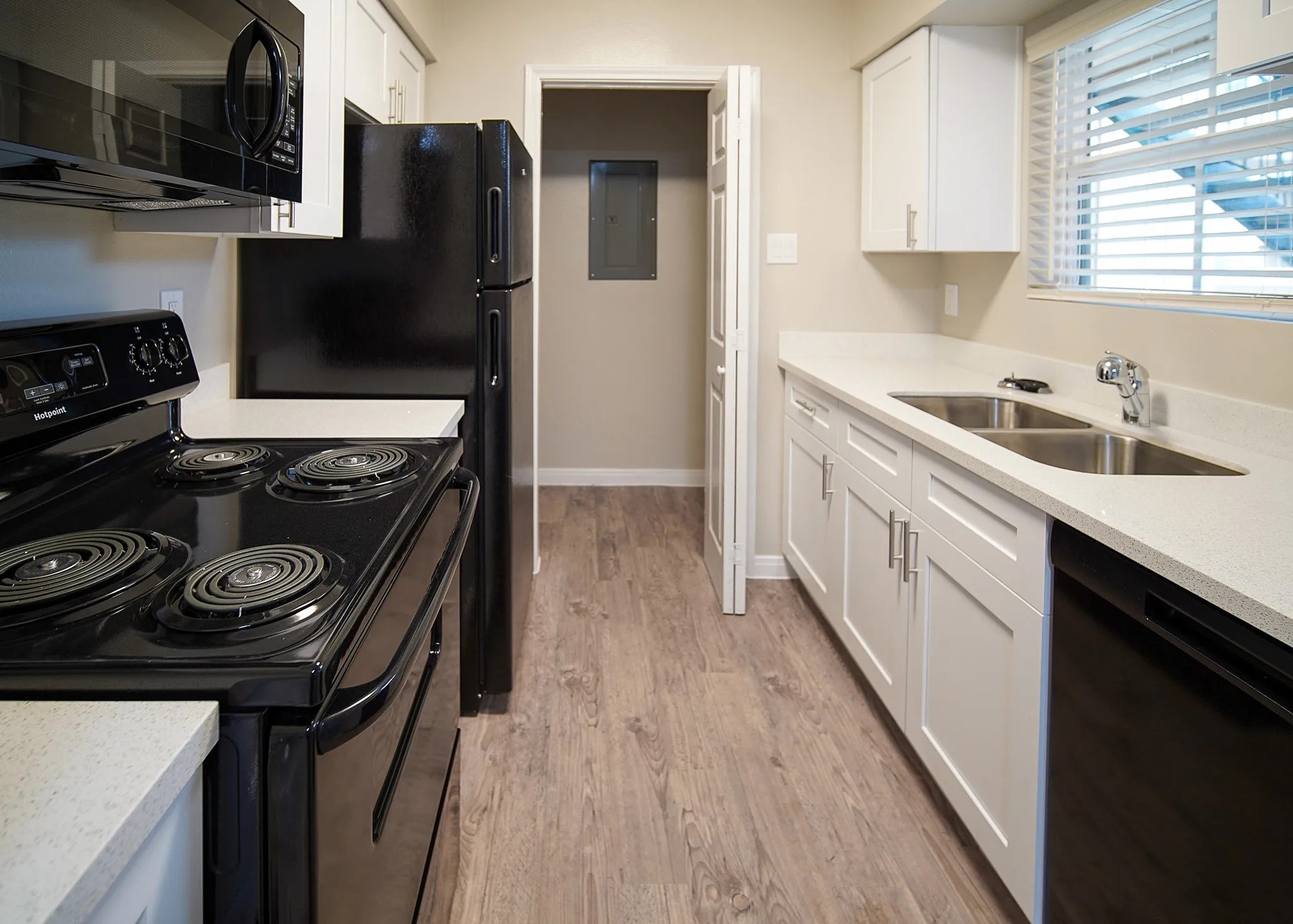 8455 Will Clayton Parkway, Unit 103 Humble, TX 77338 - Photo 7 of 23 a kitchen with a stove and a refrigerator